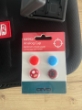 Imagen de Combo Maleta, 4x Protector Silicona Joystick Mando Control, porta juegos para 12 juegos y Hand Grip Soporte Control Nintendo Switch Joycon